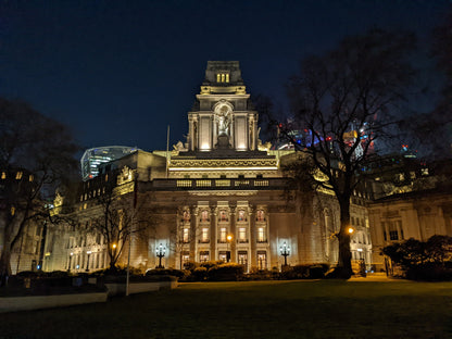 Ten Trinity Square lit at night from Trinity Square Gardens, the former Port of London Authority building that holds the spa on its lower ground floor