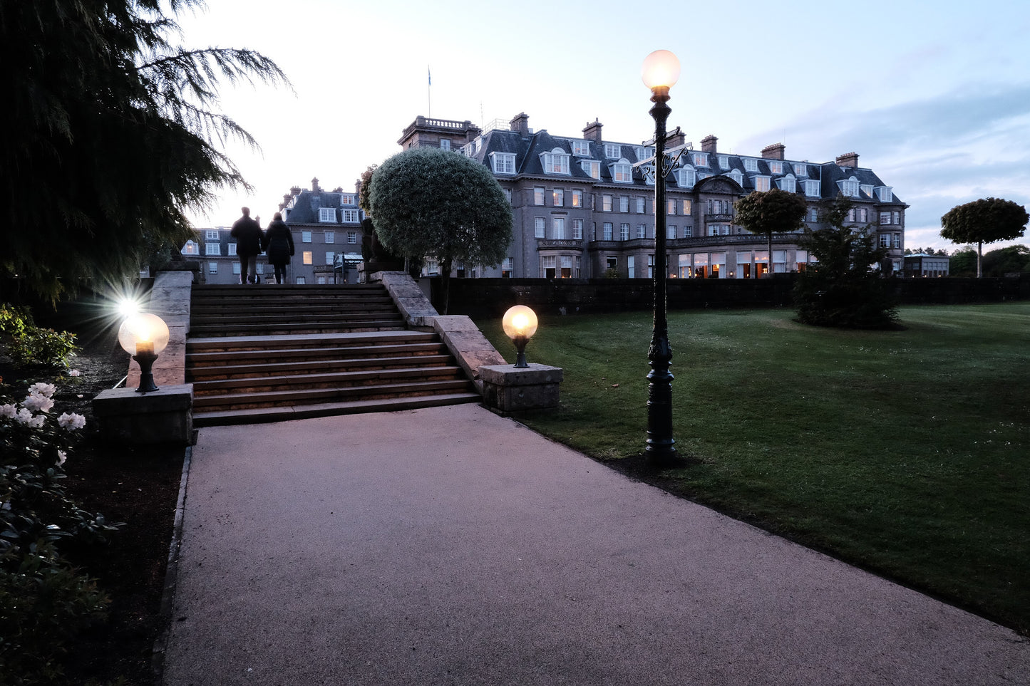 The Gleneagles Hotel at dusk, seen across the garden steps