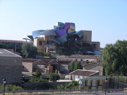 Frank Gehry's titanium ribboned Hotel Marques de Riscal rising above the town of Elciego in Rioja Alavesa