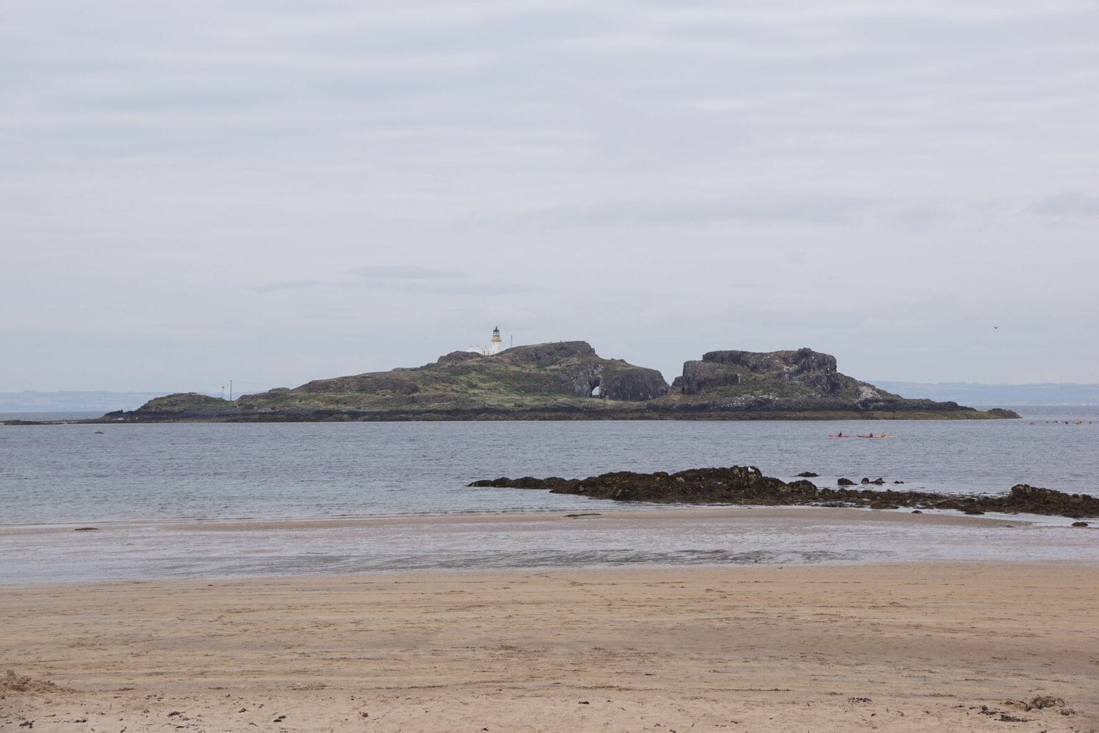 The island of Fidra and its lighthouse seen from Yellowcraigs beach at Dirleton, the coast beside the Archerfield estate. Photograph by Mike Pennington, CC BY SA 2.0.