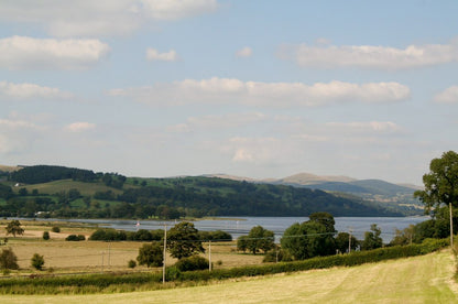Farmland and hedgerows run down to Bala Lake in the Dee Valley near Snowdonia, the landscape around Pale Hall