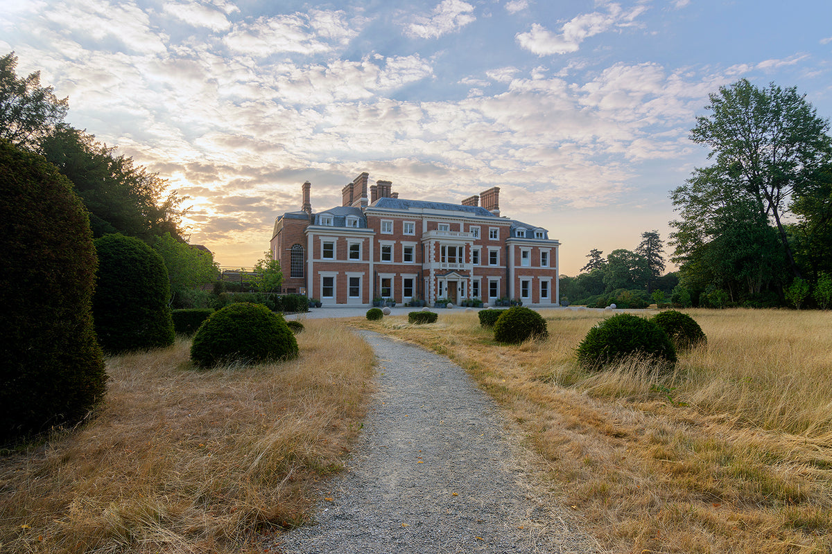 Heckfield Place's Georgian manor house across the estate parkland at dawn, home to The Bothy by Wildsmith