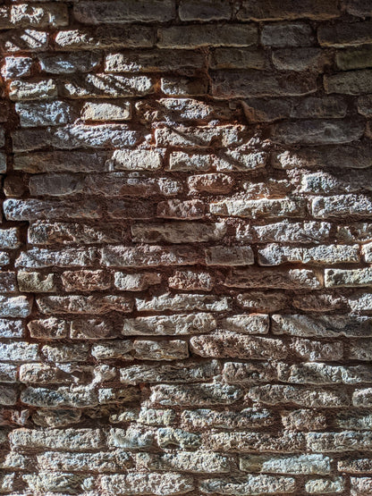 Close up of an old stone wall, the centuries old masonry the Bathhouse itself is built into