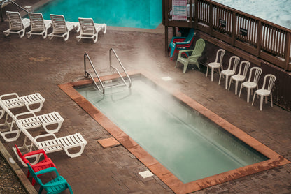 Steam lifting off heated water into cold morning air, C-Side Spa at Cowley Manor, Cheltenham