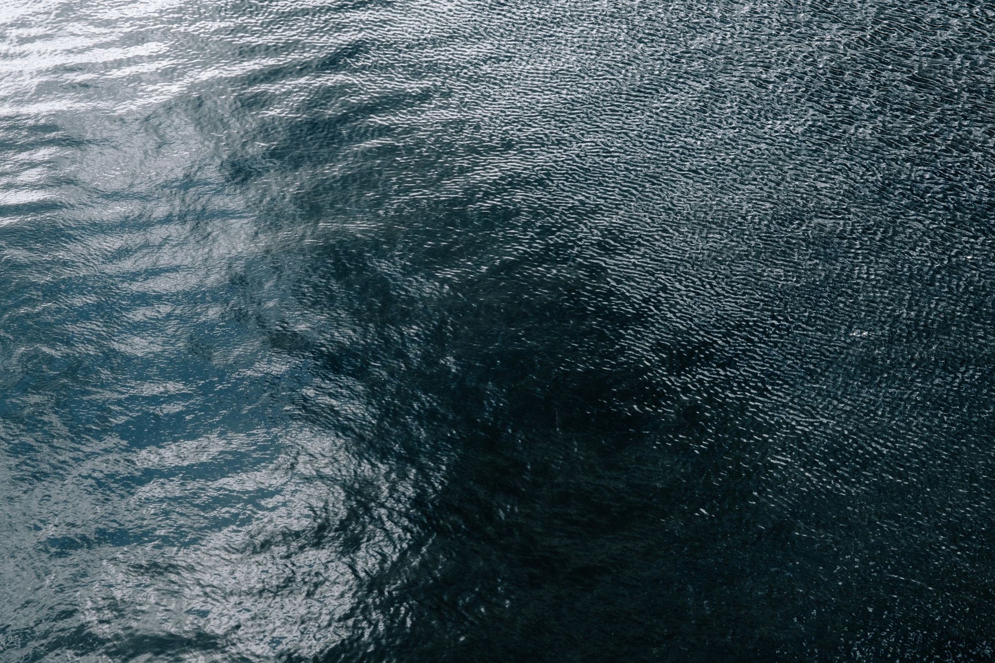 Rippled grey water, cold and still.