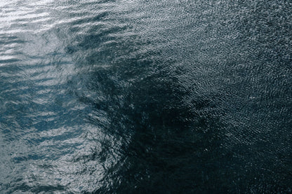 Rippled grey water, cold and still.