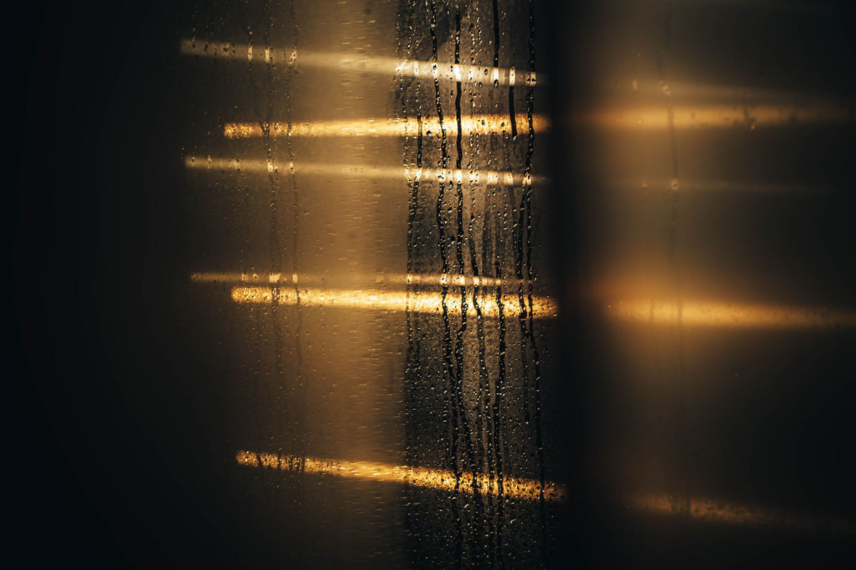 Warm light filtering through a steamed glass pane