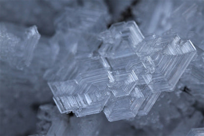 Macro detail of an ice crystal formation, evocative of an ice fountain