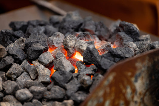 Embers glowing under hot grey stones, The House Spa at Dormy House, Broadway