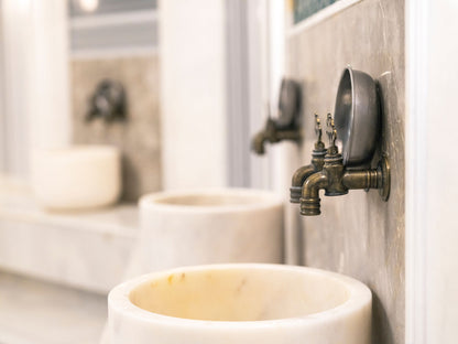 Marble surface and brass fittings in close detail