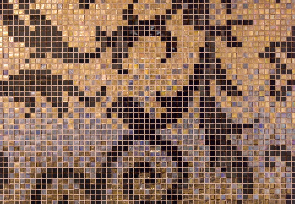 Close up of gold and black mosaic tiles, the craft behind the spa's painted pool.