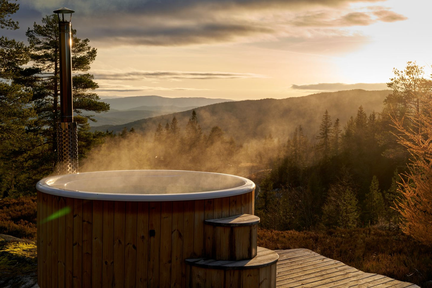 Steam lifting off a wood fired outdoor tub as the light goes, Calcot Spa, Tetbury