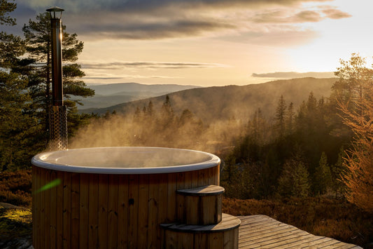 Steam lifting off a wood fired outdoor tub as the light goes, Calcot Spa, Tetbury