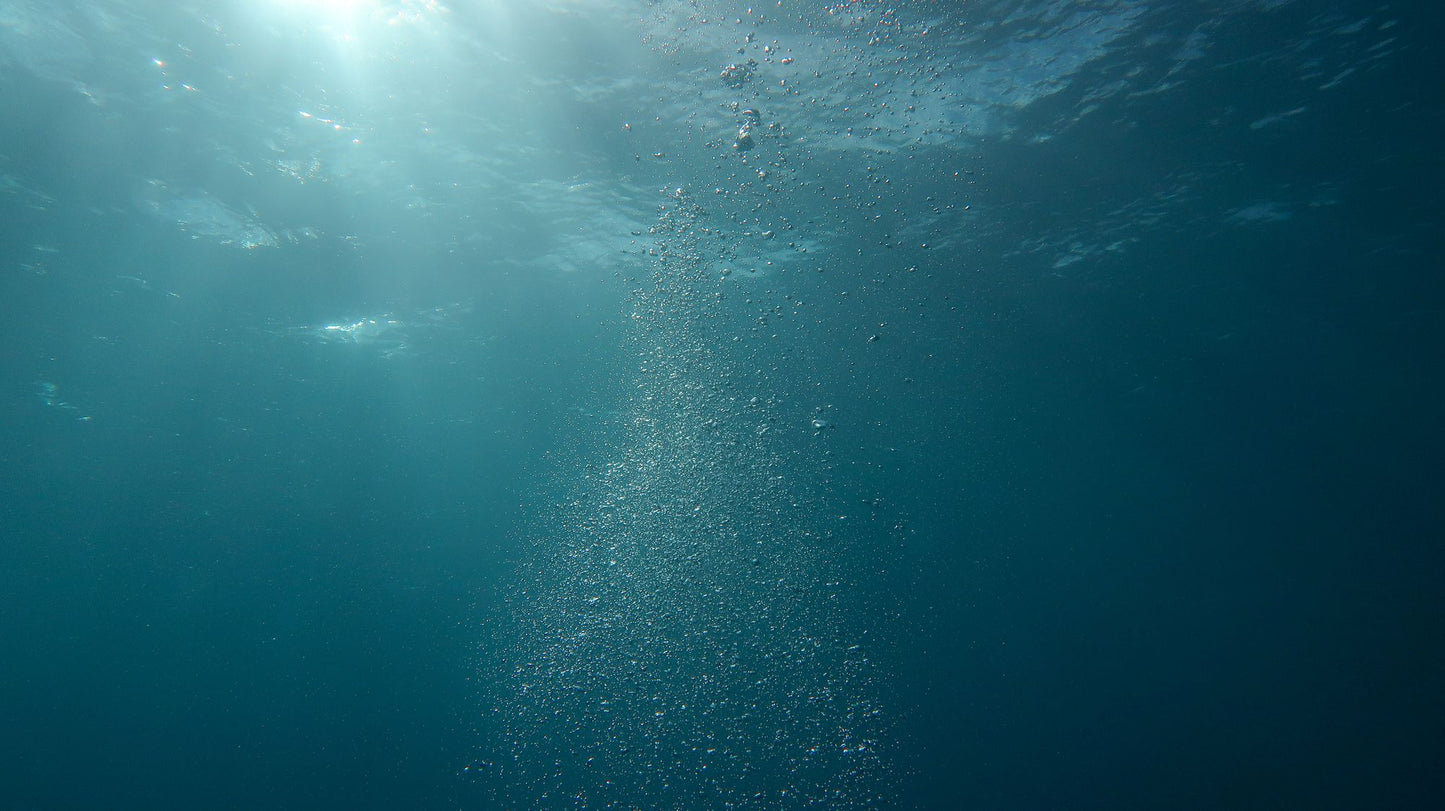 A column of fine bubbles rising through deep water, The Lanesborough Club & Spa