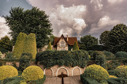 Clipped topiary and lawns in front of an English manor house, Aquarias Spa at Whatley Manor