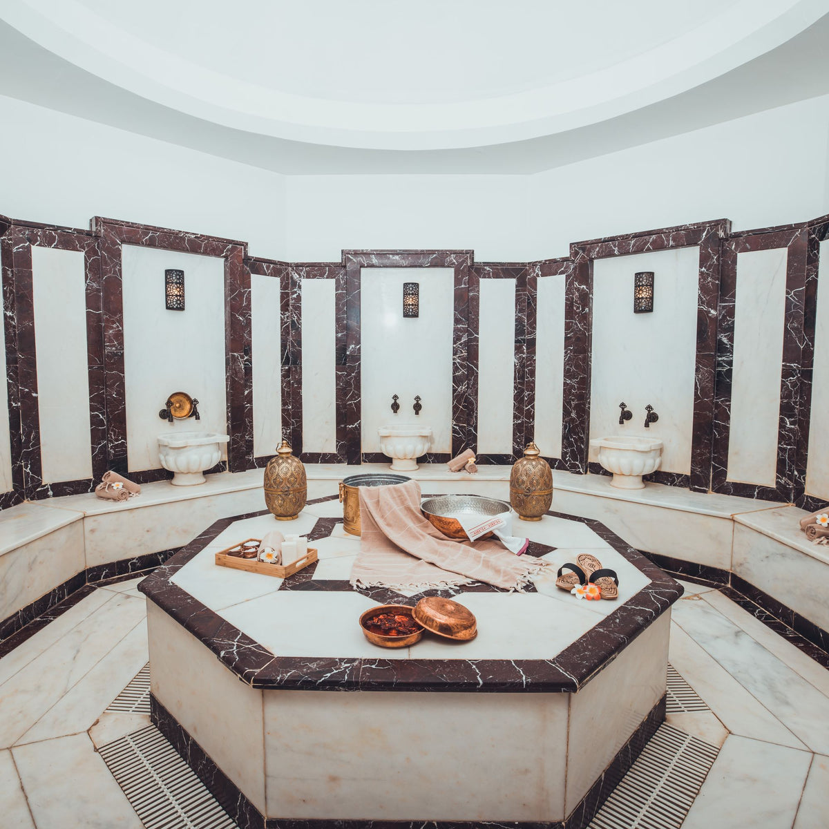Marble hammam interior with an octagonal heated stone platform