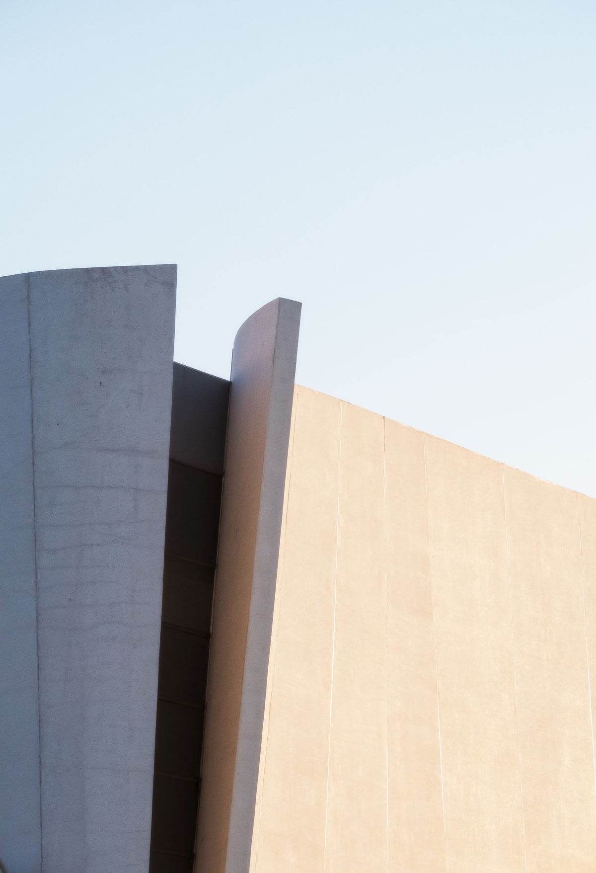 A close up of a modern building facade, evoking the deliberately modern spa building set against the historic manor