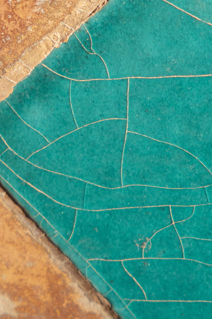 A deep turquoise glazed surface with fine gold crackle, the colour that runs across the pool hall at The Peninsula Spa