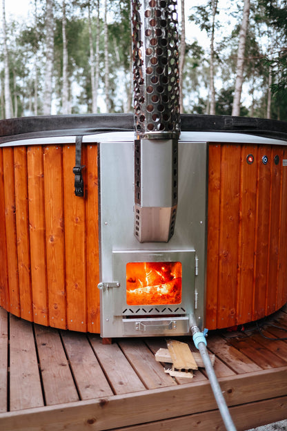 Firelight through the open door of a wood fired heater, Calcot Spa, Tetbury