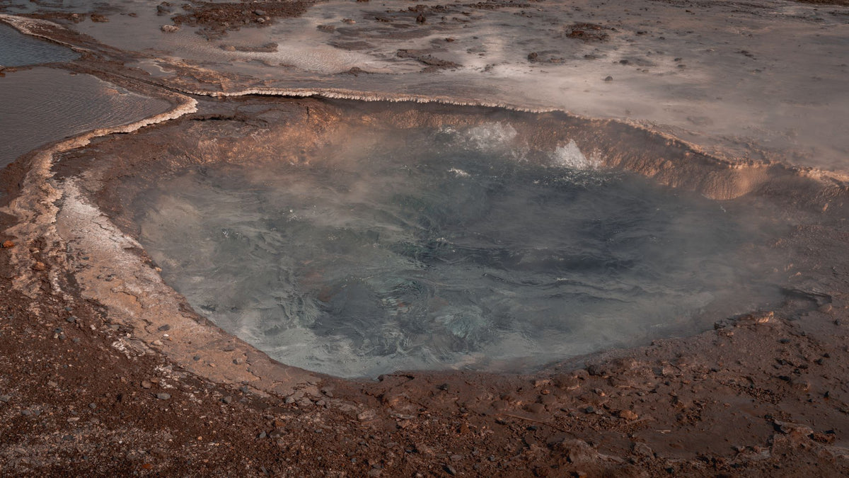 Steam rising from a natural geothermal hot spring