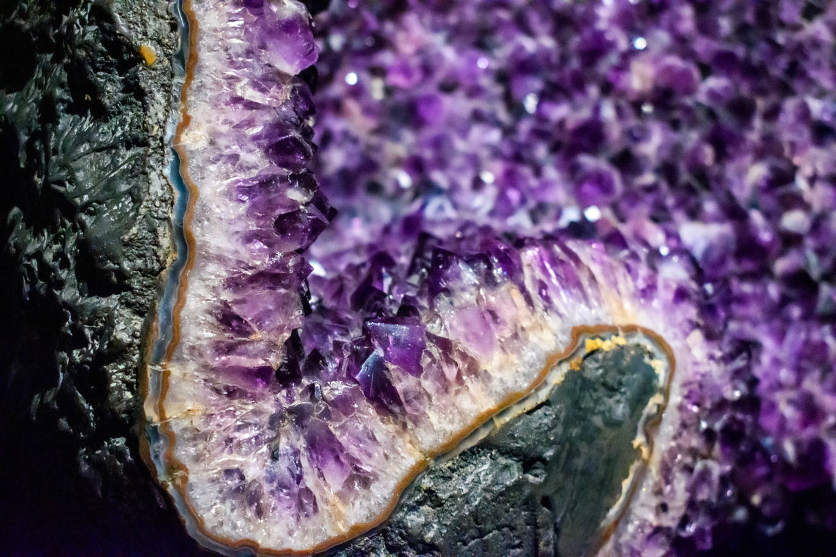 Close detail of an amethyst crystal geode in violet tones