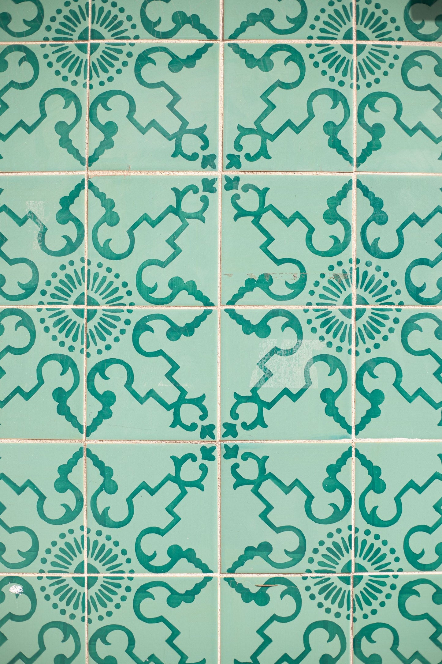 Close up of patterned teal tiles, evoking the Victorian tilework at Arlington Baths Club
