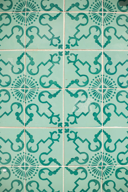 Close up of patterned teal tiles, evoking the Victorian tilework at Arlington Baths Club