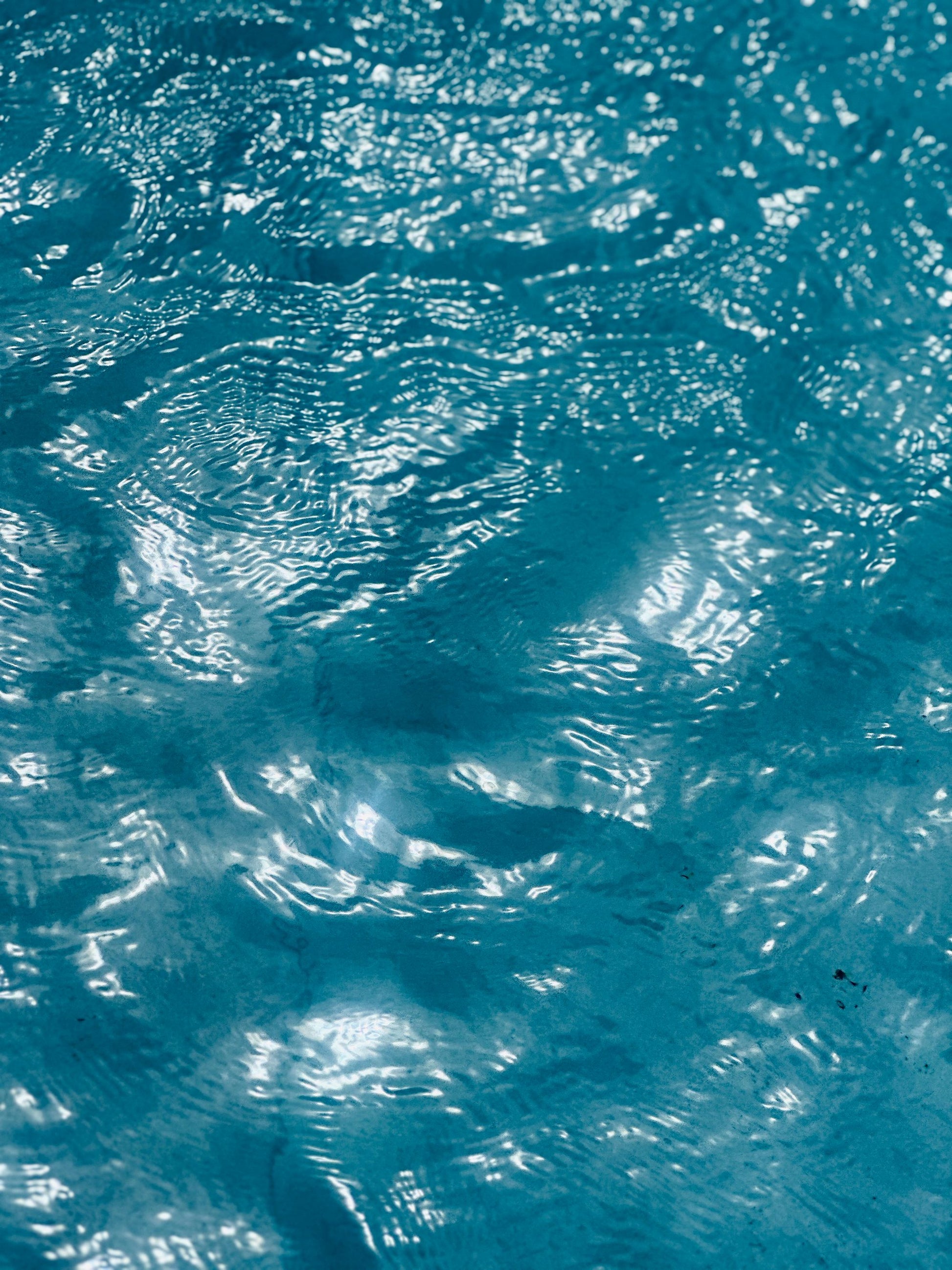 Cool, clear water in motion, the moment before a cold plunge sharpens the senses.
