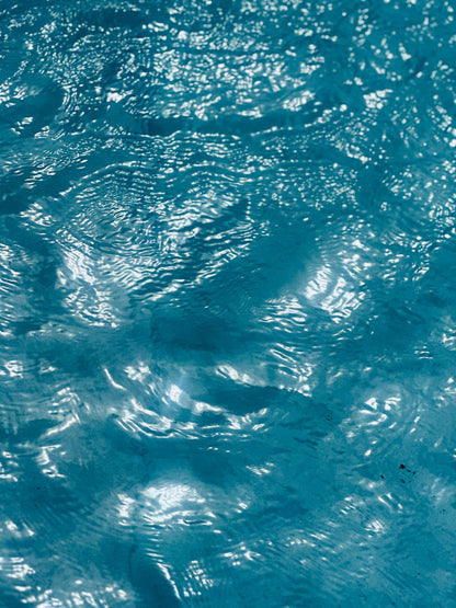 Cool, clear water in motion, the moment before a cold plunge sharpens the senses.