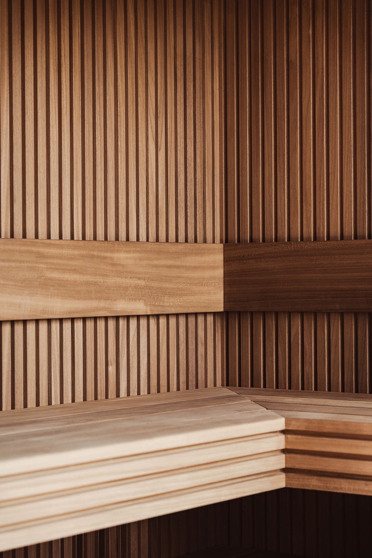 Warm cedar panelling in a Finnish style sauna, the quiet heart of a nine room thermal journey.