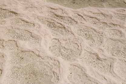 Ripples of mineral rich thermal water catching the light