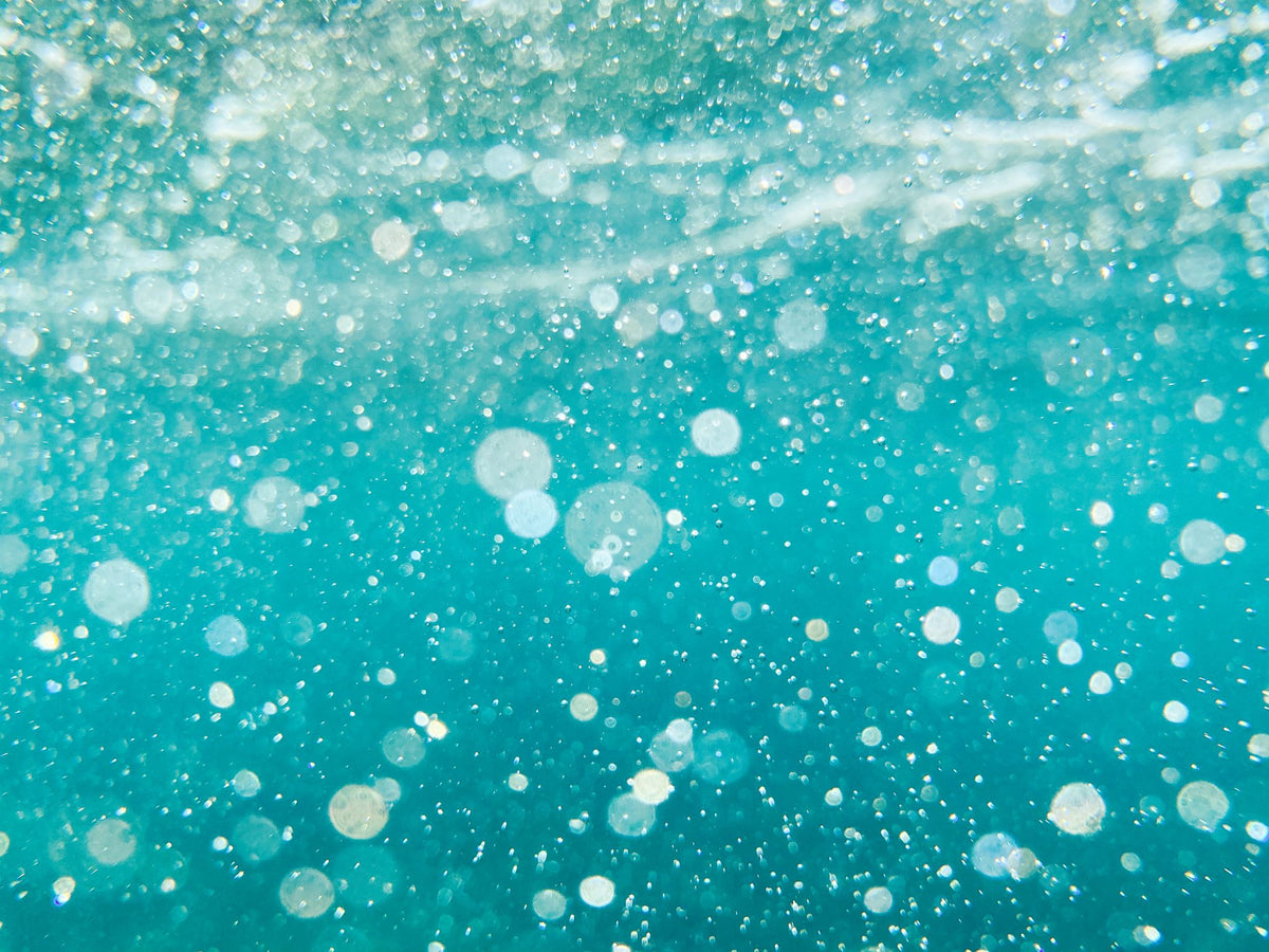 Close up of turquoise water bubbling in a vitality pool at The Bath House Spa, Royal Crescent
