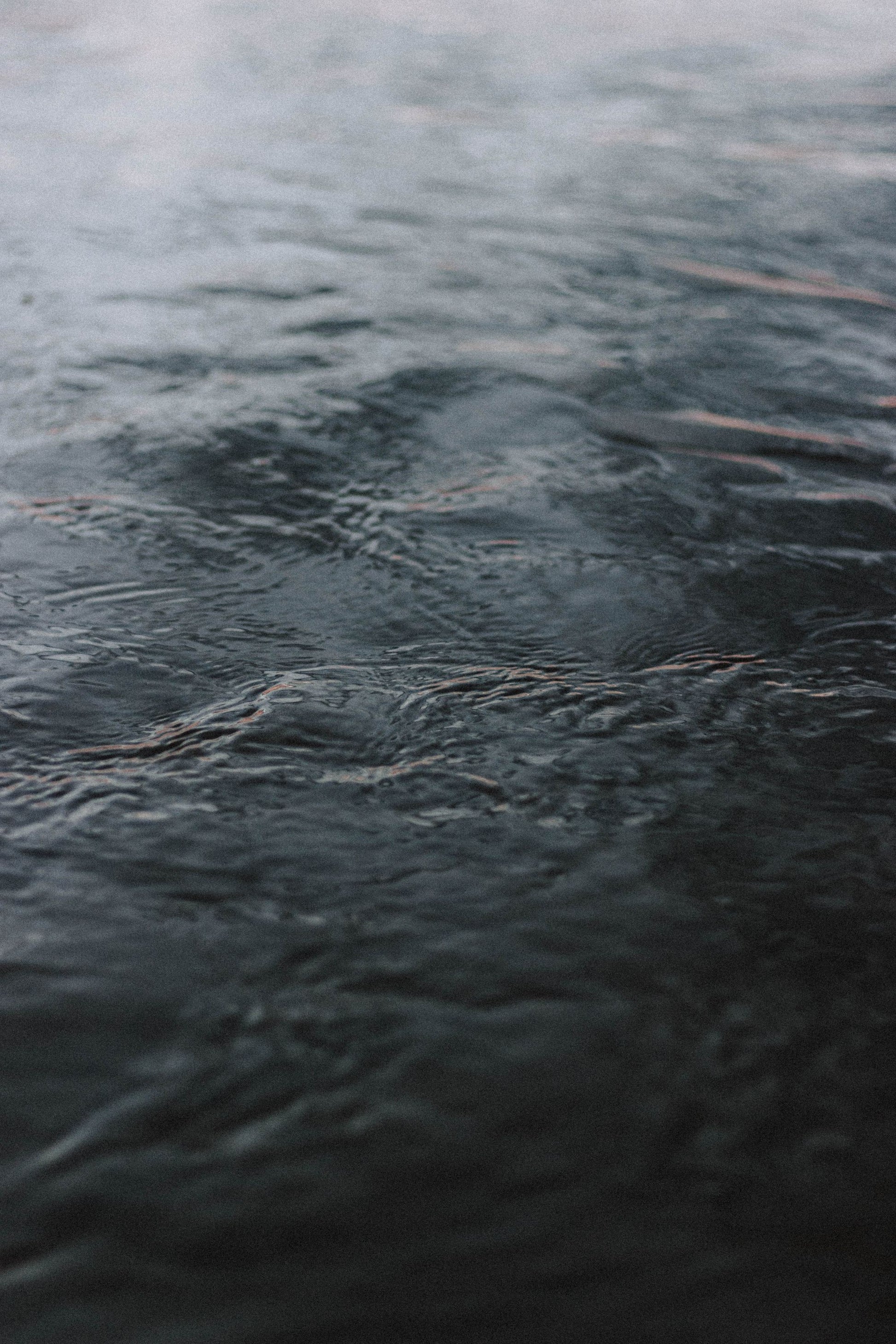 Dark water ripples across a cold plunge.
