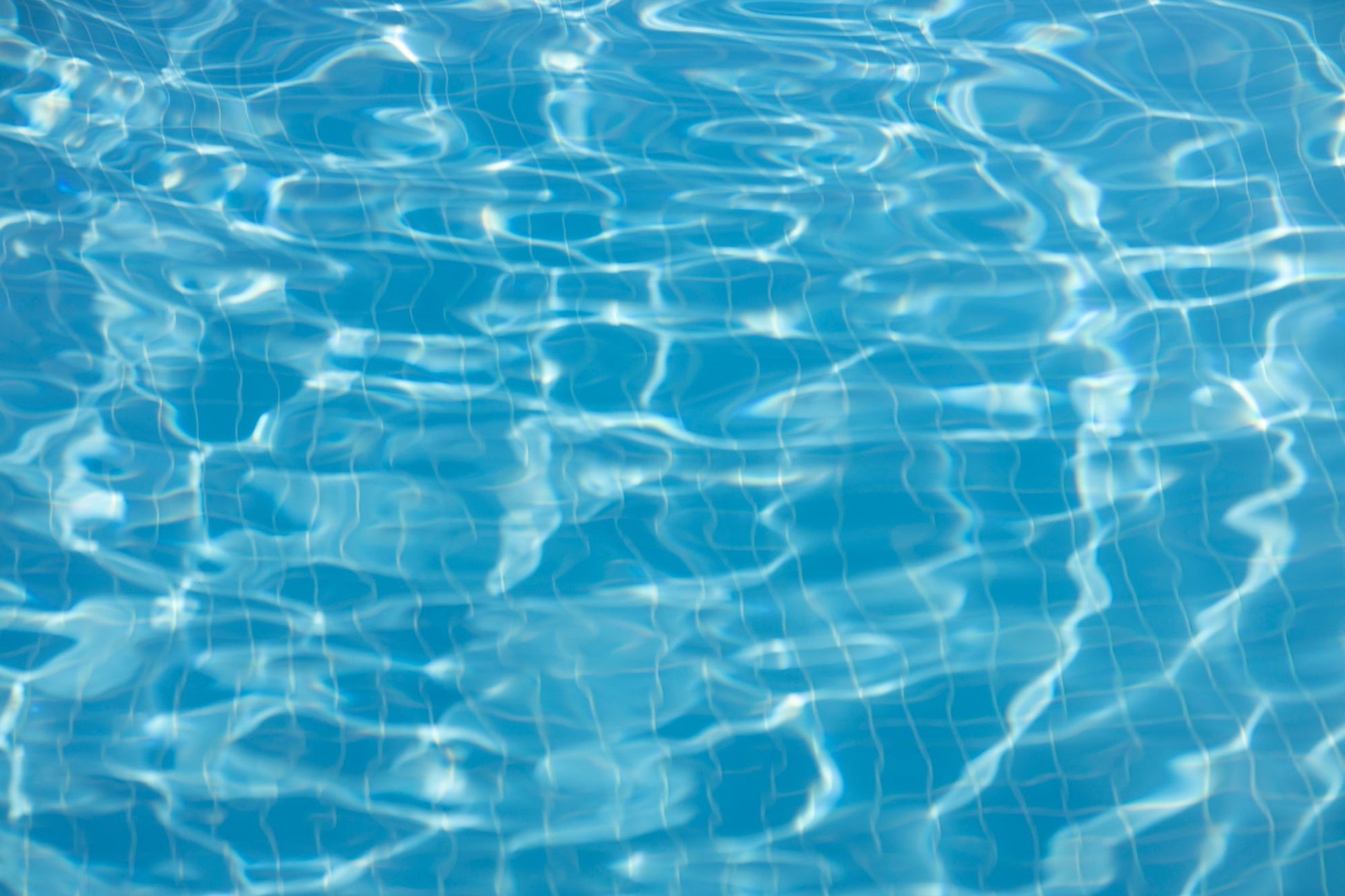 Clear blue pool water surface at Carne Bay Spa at The Nare