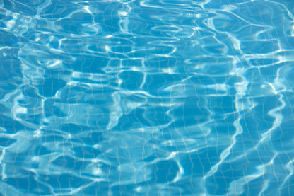 Clear blue pool water surface at Carne Bay Spa at The Nare