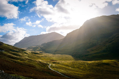 Morning sun breaking over a Scottish glen