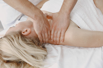 Slow work through the neck and shoulders on a treatment table, the resident osteopathy and physiotherapy at The Bvlgari Spa, Knightsbridge