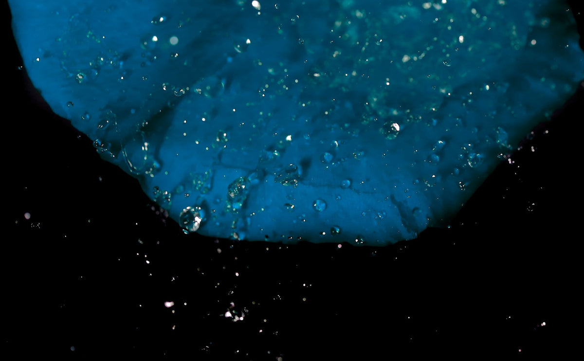 Deep blue cold water with rising bubbles, the plunge at the end of the thermal circuit