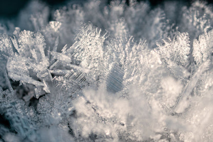 Close up of soft white frost crystals, evoking the snow shower that finishes the heat journey at the Dior Spa Cheval Blanc Paris