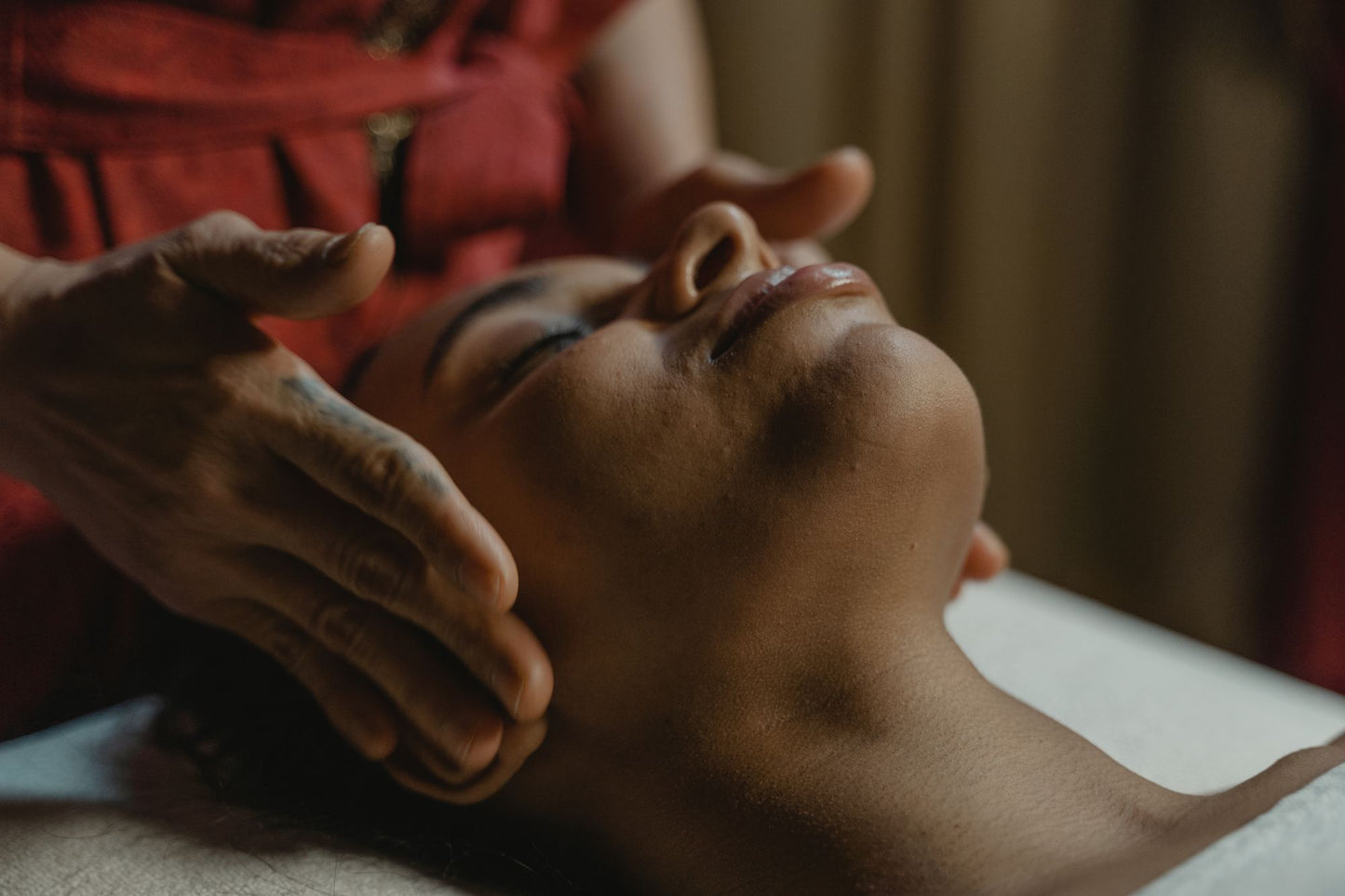 A face massage worked slowly with the eyes closed in a warm, low lit room, Asaya at The Chancery Rosewood