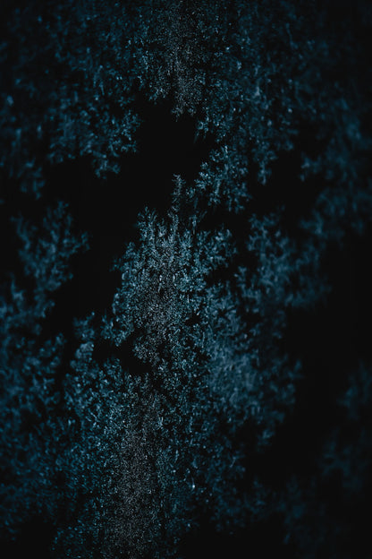 Macro frost crystals in deep blue, evoking the cold plunge at the end of the Turkish suite sequence