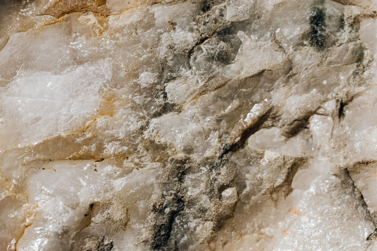 Close up of natural quartzite stone texture, evoking the spa's own interior stone