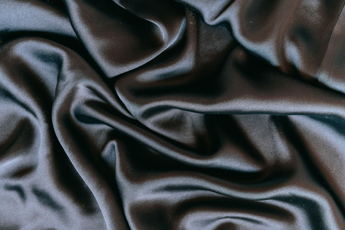Folds of dark silk in low light, Surrenne at The Emory