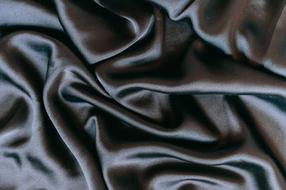 Folds of dark silk in low light, Surrenne at The Emory
