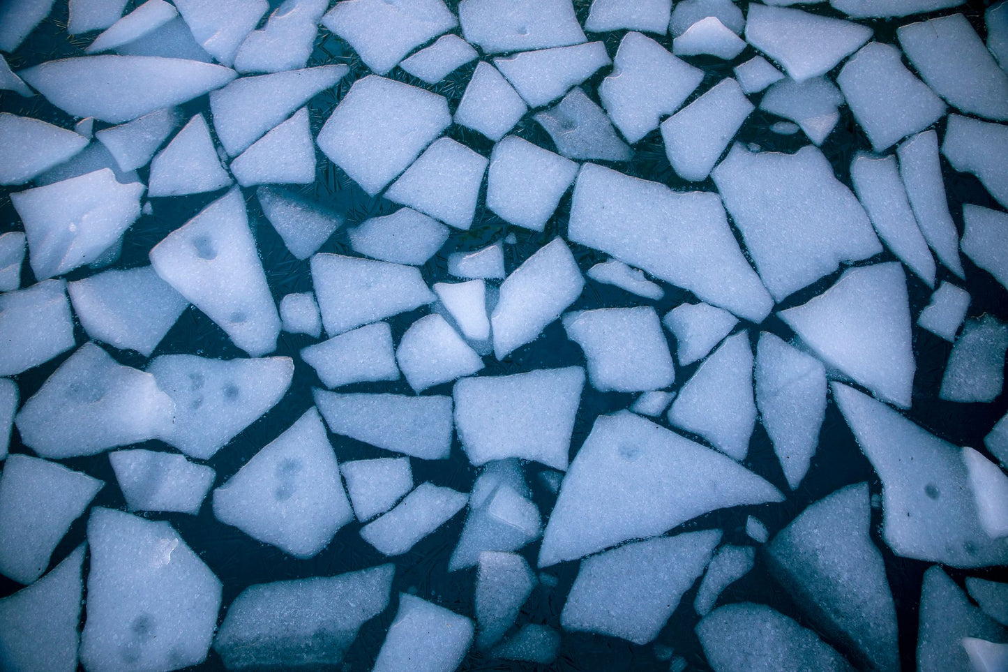 Pale shards of ice floating on cold blue water seen from above, the ice fountain and ice bath at The Bvlgari Spa, Knightsbridge
