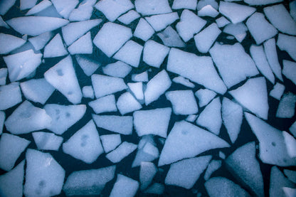 Pale shards of ice floating on cold blue water seen from above, the ice fountain and ice bath at The Bvlgari Spa, Knightsbridge