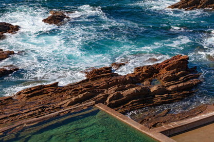 A natural seawater pool cut into coastal rocks