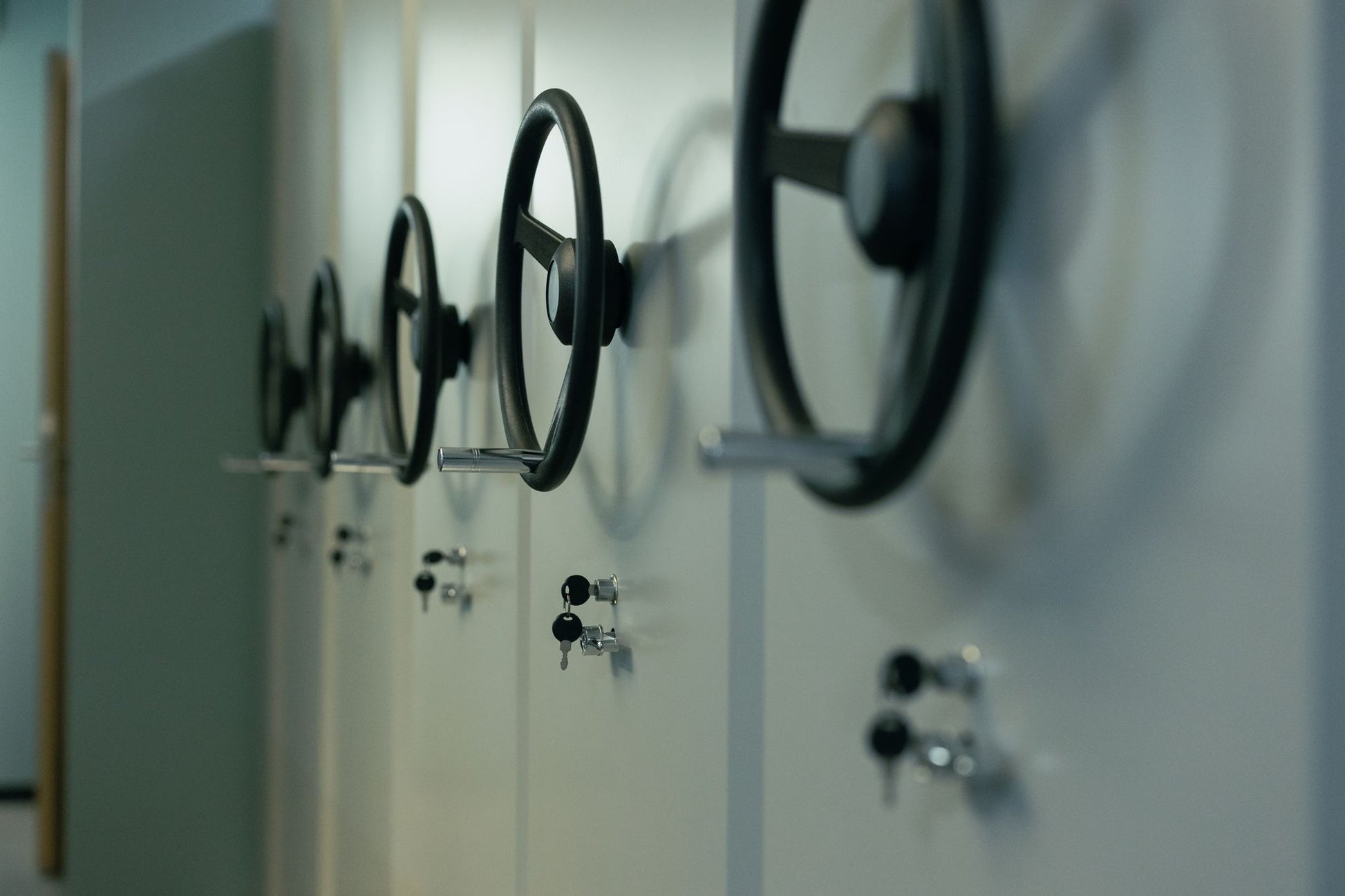 A row of old bank vault dial wheels, evoking the former strongroom the wellness floor occupies
