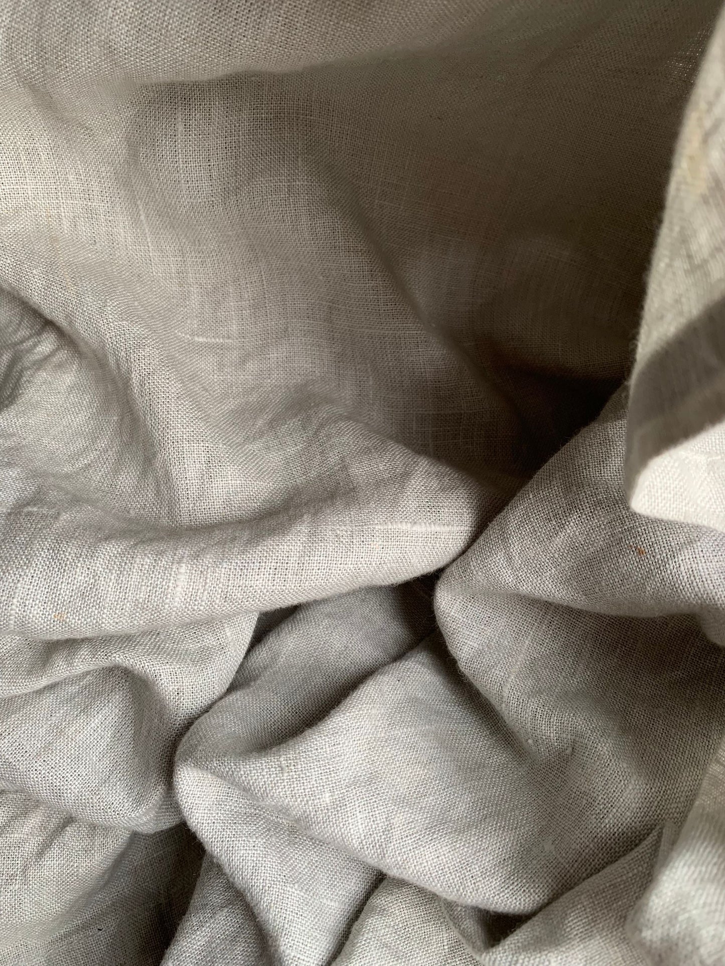 Folds of soft white linen in quiet light, Aman Spa at The Connaught