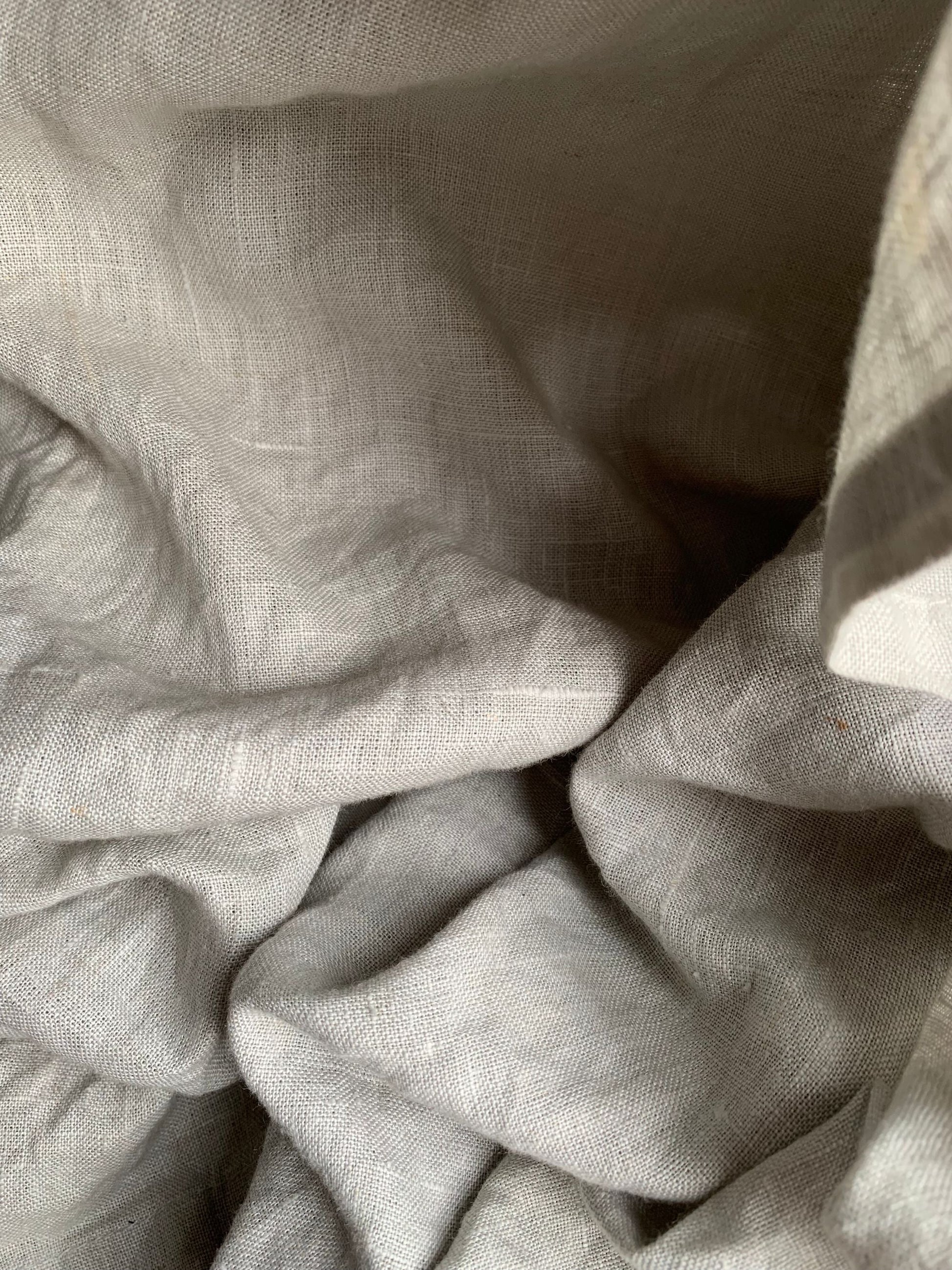 Folds of soft white linen in quiet light, Aman Spa at The Connaught